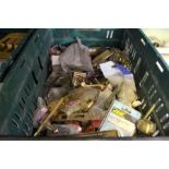 A box containing a large selection of brass door furniture etc