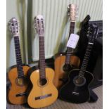 Four various acoustic guitars
