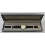 An 18k Longines Gentlemans wristwatch, with leather strap, in original box