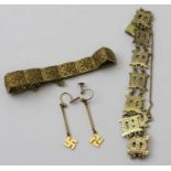 A pair of 9ct gold earrings, suspending the Buddhist "Manji" symbol, 2g, together with two decorativ