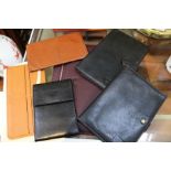 Selection of branded luxury leather goods mainly wallets