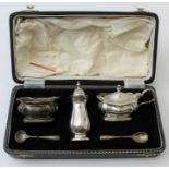 William Suckling Ltd, a silver condiment set, comprising salt, lidded mustard, pepper pot and two sp