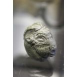 A Roman carved stone rams head, 3cm