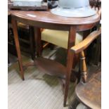 An oval topped mahogany occasional table with under tier