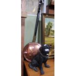 A Country Artists resin figure of a black Labrador with a copper warming pan