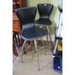 A pair of "The Chair Company" black leather swivel seat bar stools