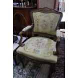 A tapestry upholstered show wood armchair