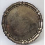 A Mappin and Webb silver salver of Georgian design, piecrust rim raised on threes feet, Sheffield 19