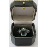 A large Aquamarine set ladies dress ring, yellow metal mounted, the shoulders Zircon set, ring size