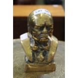A small solid brass bust of Winston Churchill