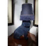 A textured 'blue pug' lamp with tasselled shade