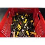 A large crate of hand tools chisels files etc