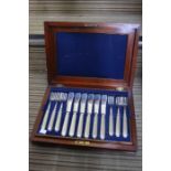 Two wooden cased sets of fish knives