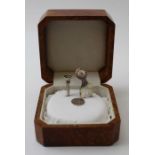 Gordon Yates, a presentation silver Golf set, comprising tee etc, silver set with rubies, in polishe