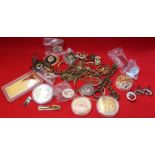 A bag containing of yellow metal jewellery, fobs, commemoratives, etc.