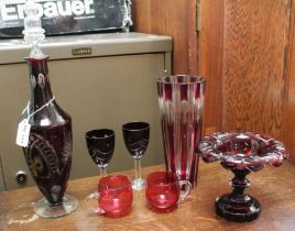 Pieces of ruby flashed glass, comprising decanter, two wine glasses, comport, fluted cut vase & two
