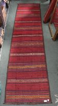 A Kelim runner of striped design 62 x 263 cm