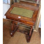 A 19th century child's writing desk with inset leather top, locking lid, key present