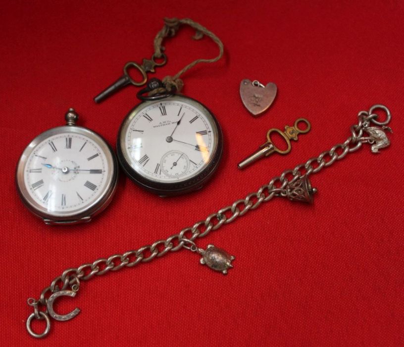 Two silver ladies pocket watches and a charm bracelet