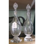 A pair of 19th century Georgian hand blown tall decanters, decorative all-over standing on bulbous &