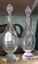 A pair of 19th century Georgian hand blown tall decanters, decorative all-over standing on bulbous &