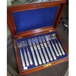 A mahogany canteen of silver plated fish knives & forks for twelve