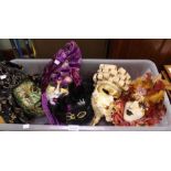 Five decorative masks in a crate