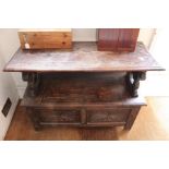 A 20th century oak Monks Bench, with carved decoration, the top hinges to become the bench back, hin