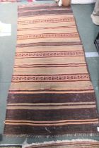 A woven woollen striped rectangular floor mat