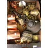 A box containing a selection of useful and collectible copper and metal wares