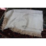 A cream ornate throw