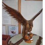 A wooden carved example of an eagle