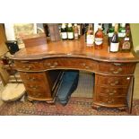 A possible 19th century twin pedestal leather top mahogany desk