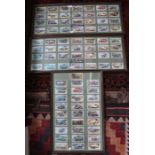 Three framed and glazed vintage motorcar collector card displays