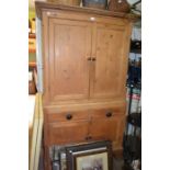 An 19th century small pine press/cupboard