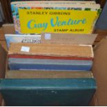 A small box of stamp albums and vintage books etc