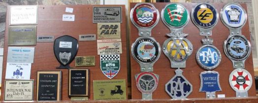 Three presentation boards mounted with a selection of car club membership badges various