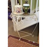 A green painted metal Demilune console table