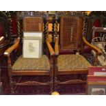 A pair of oak and bergere armchairs
