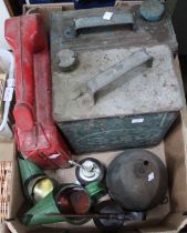 A box containing vintage fuel and oil cans to include Esso, Castrol, etc