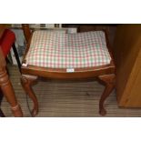 Walnut stool with shell carved knees and pad feet