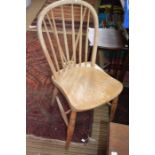 A set of four stick back kitchen chairs in need of some attention