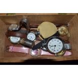 A Dukes wooden cigar box containing a selection of gents and ladies wrist watches plus