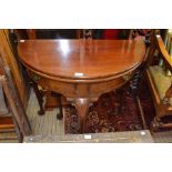 A mahogany fold top occasional table