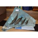 Wyland a limited edition sculpture of a family of dolphins 'The perfect wave'