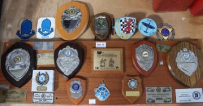 A selection of car show trophy's mounted on board, with five other loose examples