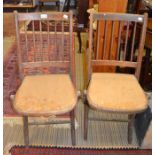A pair of folding dining chairs