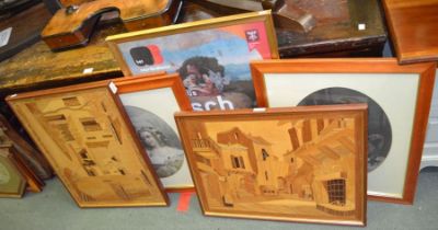 A pair of continental marquetry village scenes with a selection of decorative prints