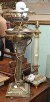 A brass column design table lamp with another onyx example