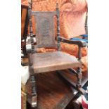 A rocking chair with leather seat